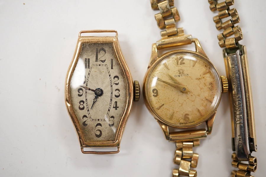 A lady's 1930's? 9ct gold manual wind wrist watch, no strap and 9ct gold Omega manual wind wrist watch on a gold plated bracelet. Condition - poor to fair